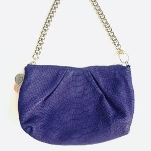 Henri Bendel purple bag wristlet